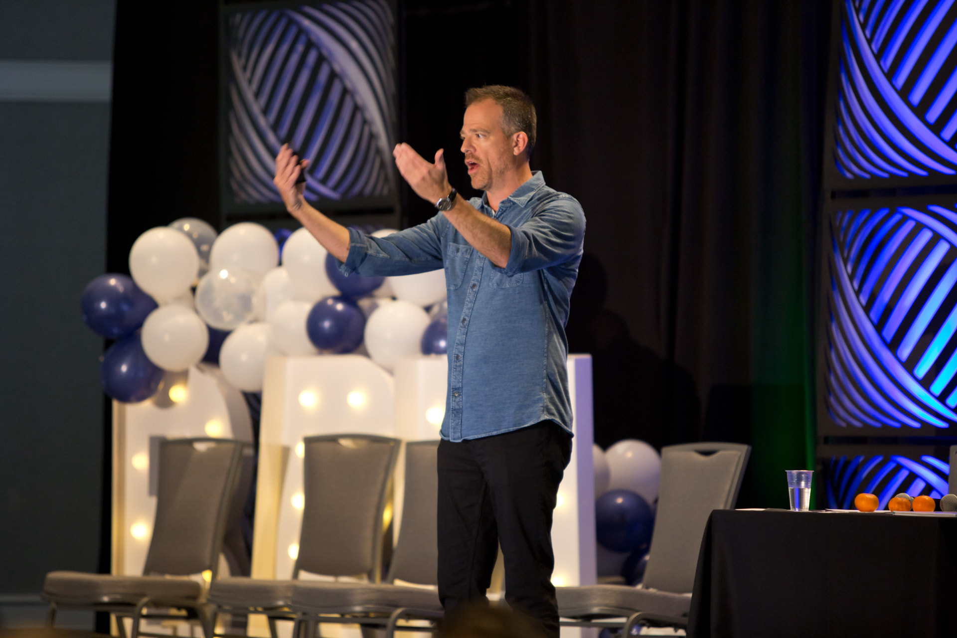 Darrel Popowich delivering a Transformation CRAFT keynote on stage.